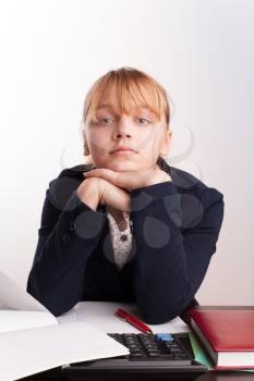 Portrait of blond Caucasian girl sitting in the school