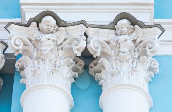 Decoration of Russian Orthodox cathedral facade, columns small capitals with white angels sculptures