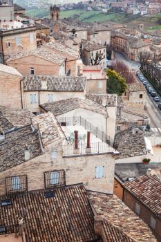 Roofs of Fermo, Italy. Old stone living houses, vertical photo