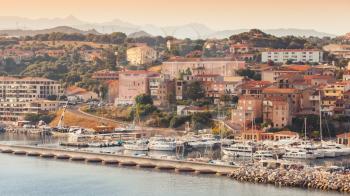 Propriano port at early morning in warm sunlight, South Corsica, France
