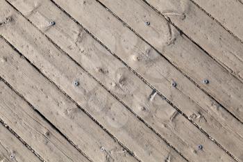 Old gray wooden floor with screw, background photo texture