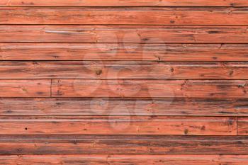 Old red wooden wall, detailed background photo texture. Scandinavian rural architecture details 