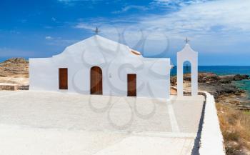 Agios Nikolaos. White Orthodox church on the Ionic Sea coast. Zakynthos island, Greece