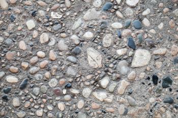 Ancient stone road pavement, closeup background photo texture