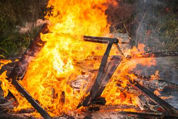 Close up photo of burning firewood in big bonfire