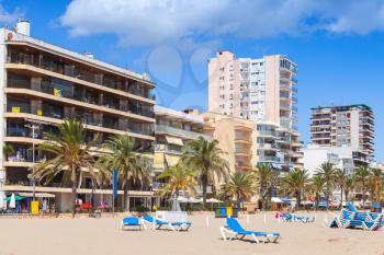 Public beach of Calafell resort town in a sunny summer day. Tarragona region, Catalonia, Spain