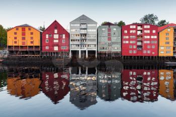 Colorful traditional wooden houses in a row, old town of Trondheim, Norway. Coast of Nidelva river