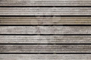 Grungy gray wooden wall made of boards, background photo texture