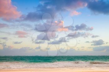 Atlantic ocean coast. Landscape with colorful cloudy sky in sunrise, Dominican republic. Punta Cana. Bavaro beach