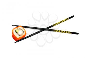 Japan sushi roll in the chopsticks isolated on white