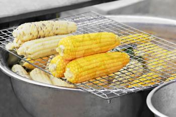 Corn cooking in the boiling water