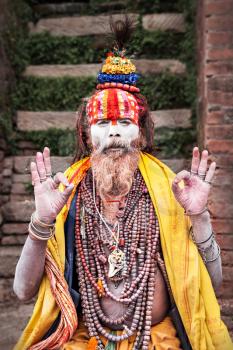 KATHMANDU - APRIL 15: Sadhu at Pashupatinath Temple in Kathmandu, Nepal on April 15, 2012. Sadhus are holy men who have chosen to live an ascetic life and focus on the spiritual practice of Hinduism