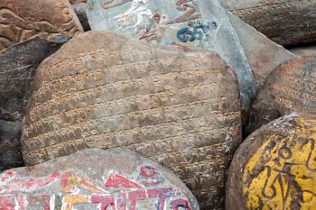 Om mani padme hum stones near tibetan monastery