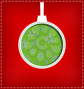 Green Christmas ball cutout on red background