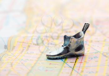 road map with statuette shoes.with selective focus