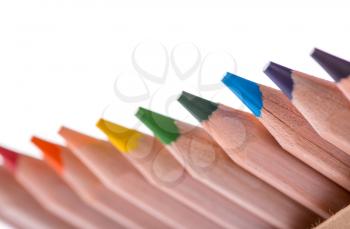 Colorful pencils in a row isolated on white