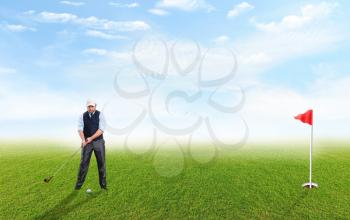 Adult businessman plays golf in fresh air