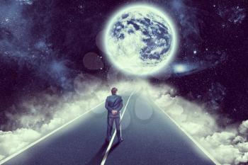Businessman standing back on the road in space