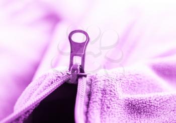 Closeup of zipper opening pink fleece jacket