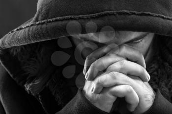 Despair bandit praying God for forgiveness