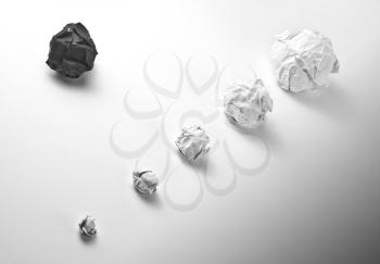 Concept of crumpled paper balls on white