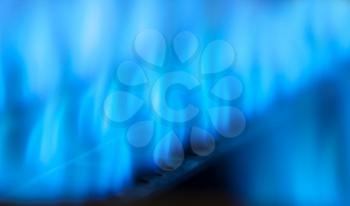 Close-up view of blue flames in gas boiler