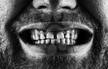 Close-up of a scary screaming bearded mouth