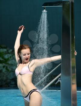 Sexy wet bikini woman in shower
