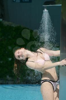 Sexy wet bikini woman in shower