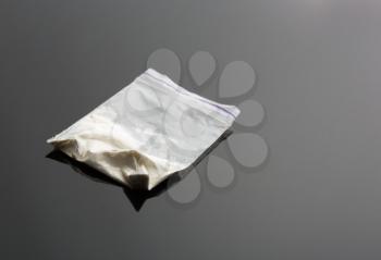 Cocaine in package on grey  background