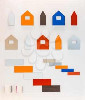 Cardboard patterns of multicolored buildings against white