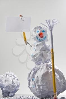 Paper snowman with sign. Office jokes