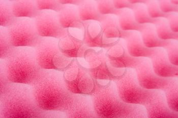 Close-up of pink cleaning sponge. Perspective view