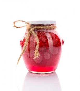 Glass jar of raspberry jam. Brown rope. Isolated over white.