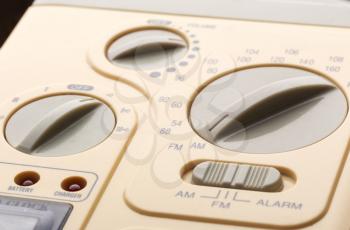 Beige control panel of radio with many buttons, closeup picture