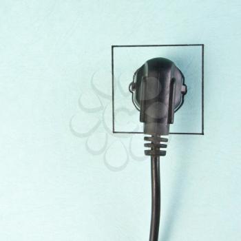 Electrical plug in drawn socket on the wall