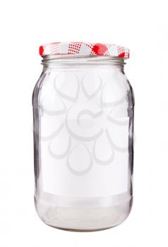 Close-up of a glass jar with label isolated on white
