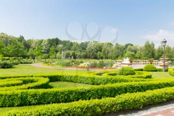 Luxurious summer green park with lake