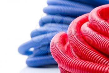 Rolls of red and blue water pipes