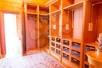 Wide dressing room with many shelves interior