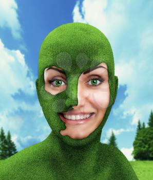 The concept of green woman's head on nature background