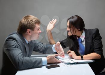 Two young caucasian office worker starting to fight