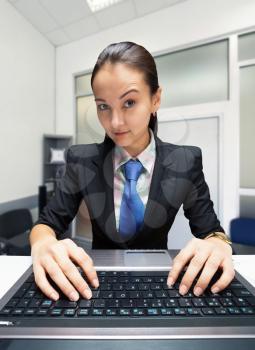 Young caucasian businesswoman working with laptop
