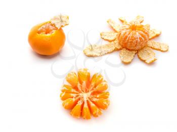Two peeled tangerine and one unhulled isolated on white background
