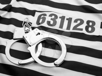 Striped dress for prisoners? handcuffs and number