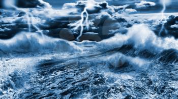Dark stormy sea with dramatic sky and lightnings