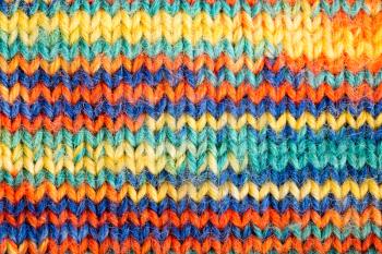 Knitted multicolored scarf closeup. Texture or background