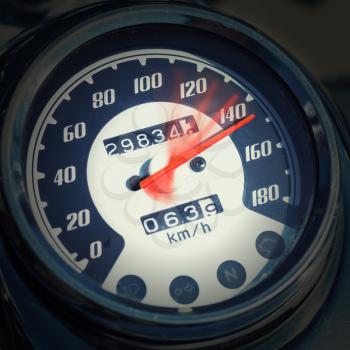 Closeup of chromed motorcycle speedometer