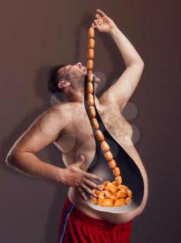 Bearded fat man eating big rope of sausages 