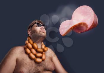 Man with sausages round his neck dreaming about a piece of wurst